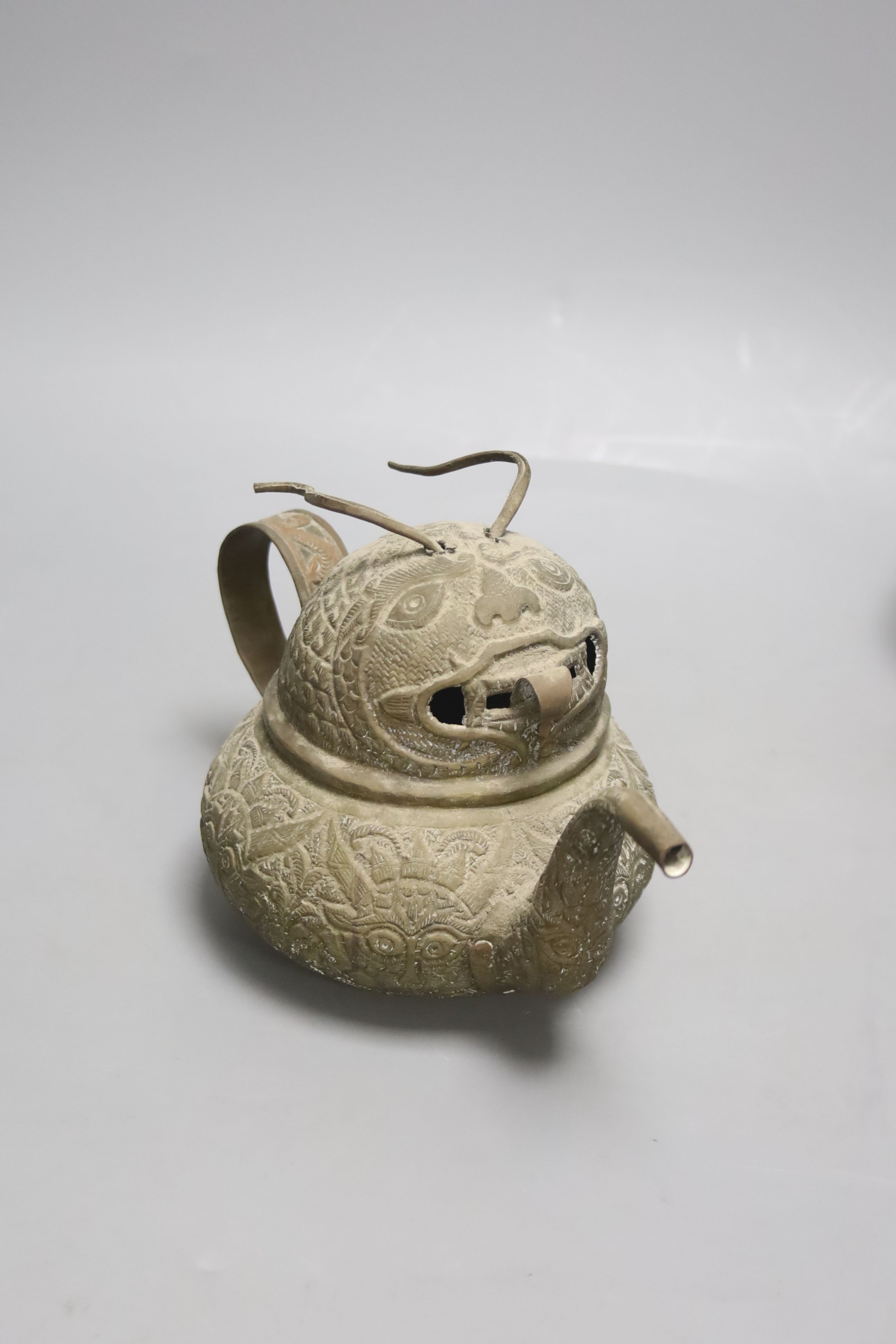 A trio of Chinese pewter mounted Yixing teapots